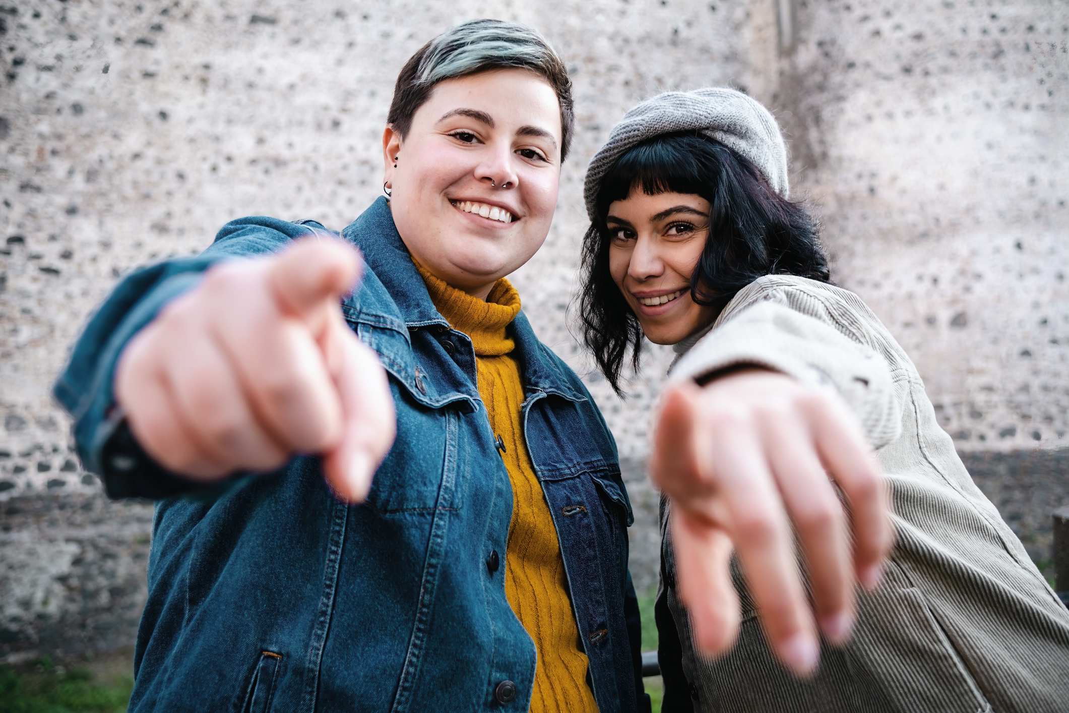 Young people pointing at camera. Mental Health Awareness Month.
